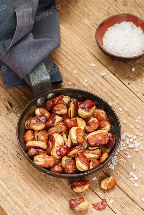 Preview: Vicia Faba. Crispy Fried (Roasted) Broad Beans With Salt In A Frying Pan Close-Up On A Wooden Old