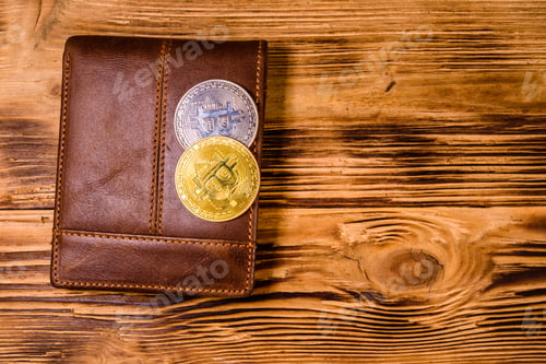 Preview: Brown Leather Wallet And Bitcoins On Wooden Background. Top View