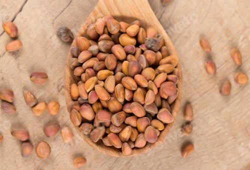 Preview: Pine Nuts On Wooden Surface