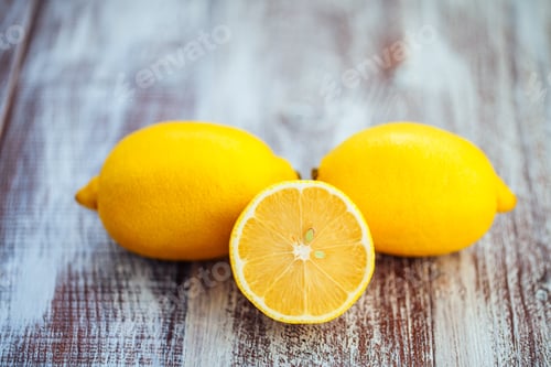 Preview: Isolated Lemon On A Wooden Background