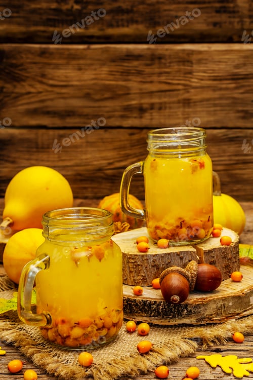 Preview: Vitaminic Healthy Sea Buckthorn Tea In Small Glass Jars With Fresh Berries And Autumn Decor. Fall