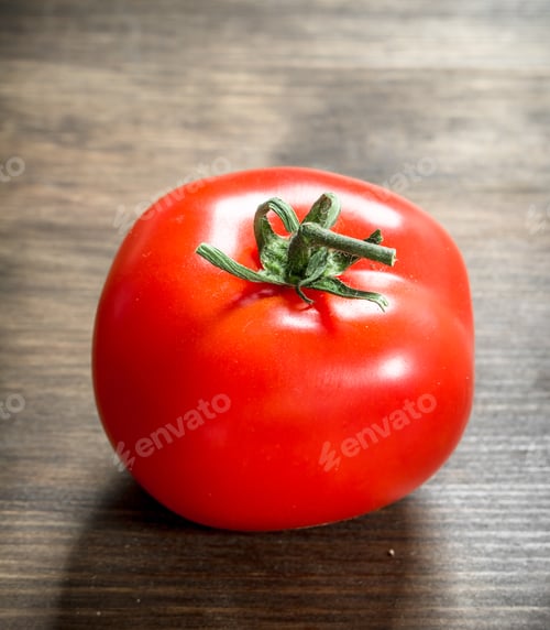 Preview: Fresh Ripe Tomato. On A Wooden Table.