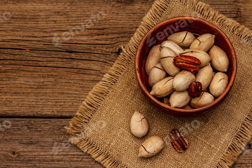 Preview: Ripe Pecan On Vintage Wooden Background. Traditional Ingredient For Pecan Pie In Usa