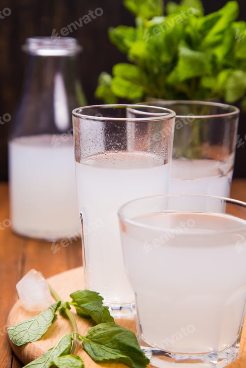 Preview: Fresh Soda Drink With Ice And Mint On Wooden Background