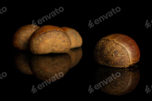 Preview: Group Of Four Whole Sweet Brown Chestnut Isolated On Black Glass