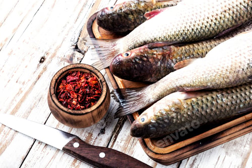 Preview: Fresh Raw Fish On Wooden Cutting Board.Raw Fish With Spices For Cooking