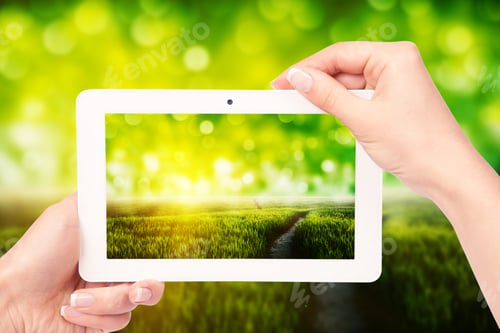 Preview: Tablet Computer Isolated In A Hand On The White Backgrounds