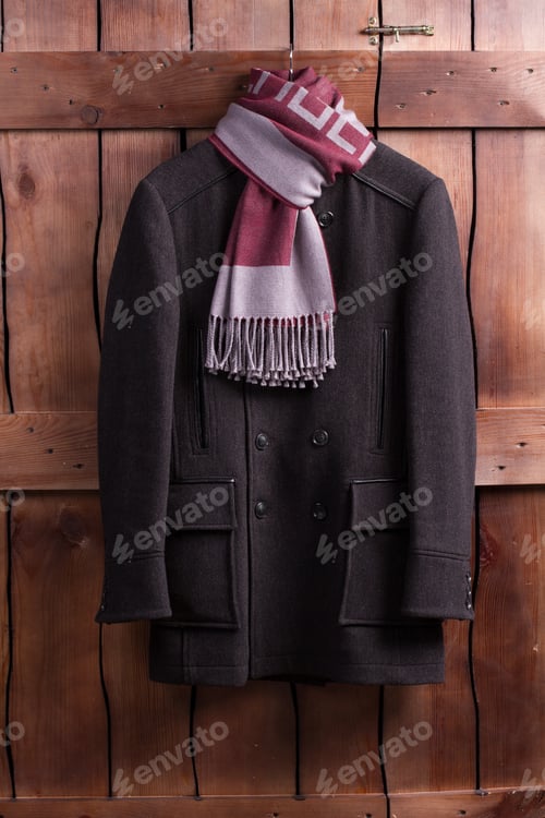 Preview: Beautiful Overcoat With A Scarf Hanging On A Wooden Fence.