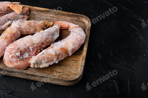 Preview: Frozen Red Argentinian Prawns Set, On Wooden Tray, On Black Background , With Copyspace And Space