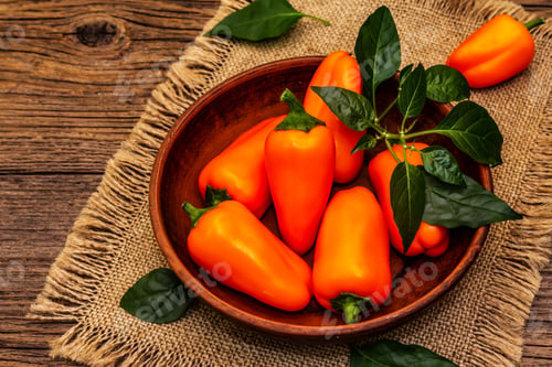 Preview: Ripe Whole Orange Mini Peppers In Clay Bowl. Fresh Harvest, Traditional Ingredient For Cooking