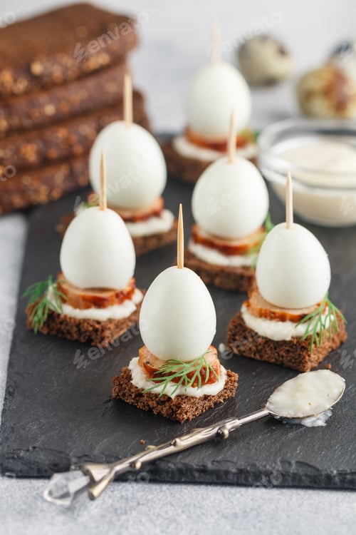 Preview: Black Rye Bread Appetizer With Sausage, Quail Eggs, Dill And Horseradish Sauce. Mini Sandwiches