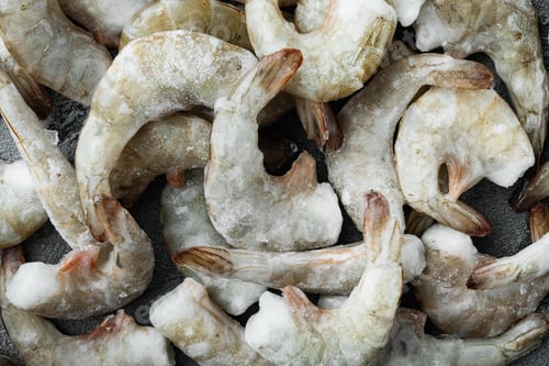 Preview: Frozen Raw Uncooked Tiger Prawns, Shrimps Set, On Gray Stone Background, Top View Flat Lay