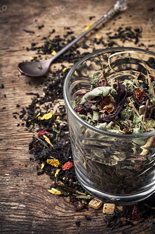 Preview: Tea Leaves Scattered On The Table In Country Style.Selective Focus