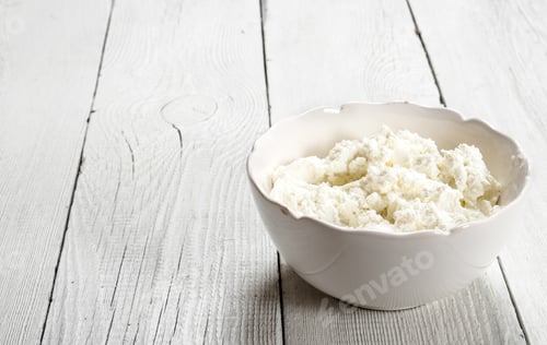 Preview: Cheese From Fresh Milk. On A White Wooden Background.