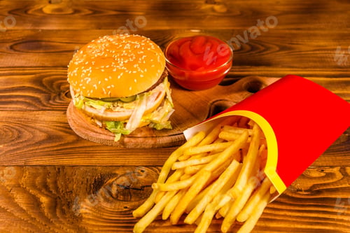 Preview: Hamburger And French Fries On Rustic Wooden Table