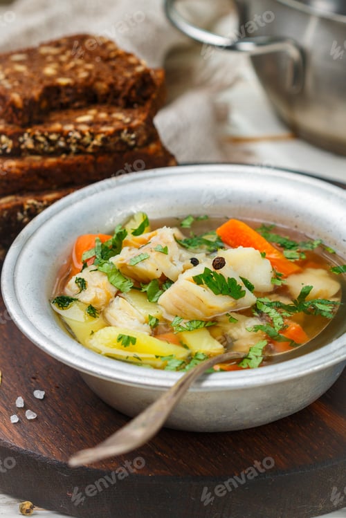 Preview: Fresh White Fish Soup With Carrots, Potatoes, Onions, Herbs And Spices. Rustic Style. Selective
