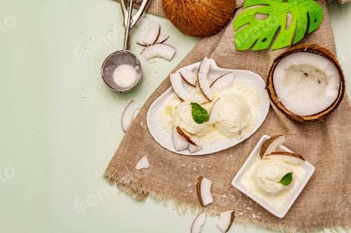 Preview: Lactose Free Coconut Ice Cream. Special Spoon, Halves Of Fruit, Flakes. Vegan Dessert Concept