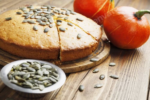 Preview: Pumpkin Cake With Seeds On A Wooden Table