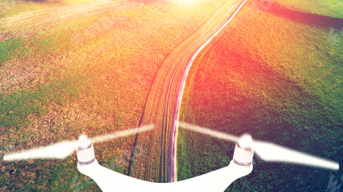 Preview: Drone With A Camera On A Green Field.