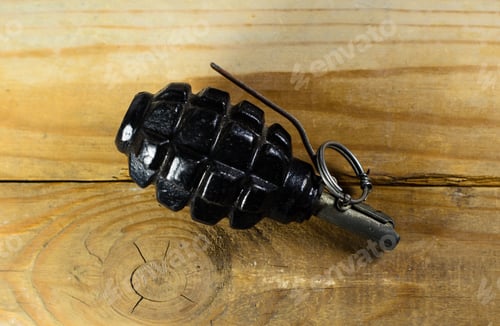Preview: Black Hand Grenade On The Wooden Table