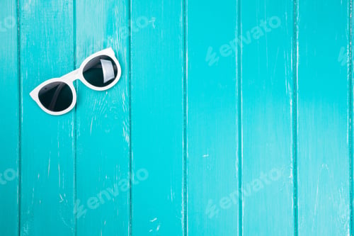 Preview: Stylish White Sunglasses On A Blue Background