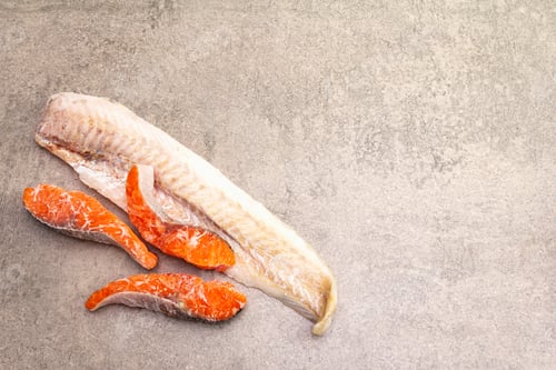 Preview: Assorted Frozen Fish. Hake Fillet And Salmon Pieces. Ingredients For Healthy Food Cooking. Stone