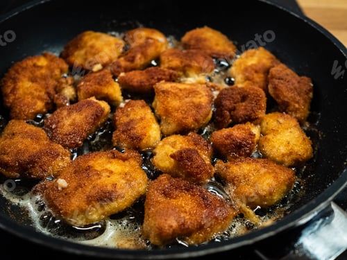 Preview: Breaded Chicken Breast Nuggets Frying In Pan
