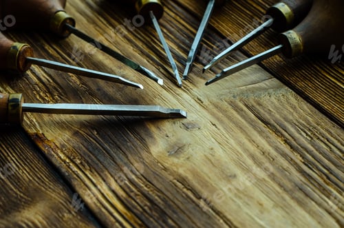 Preview: Different Gravers For Jewelry On A Wooden Background