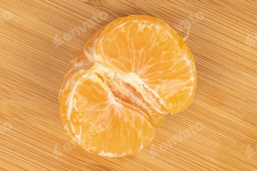 Preview: One Half Of Purified Fresh Orange Mandarin Flatlay On Light Wood