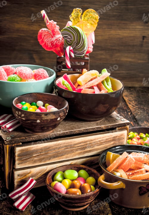 Preview: Different Sweet Candy, Jelly, Marshmallows And Candied Fruits. On A Wooden Background.
