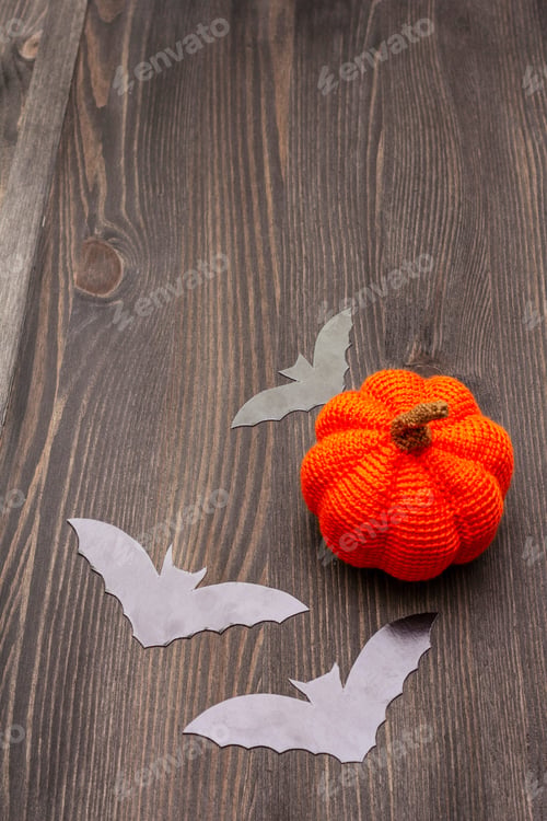 Preview: Halloween Decoration Concept - Black Bats And Orange Pumpkin On Dark Wooden Background. Wallpaper