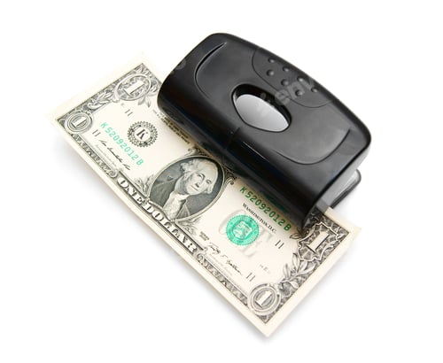 Preview: Money In Puncher. On A White Background.