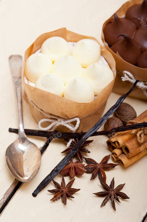 Preview: Fresh Baked Chocolate Vanilla And Spices Cream Cake Dessert Over Rustic Wood Table