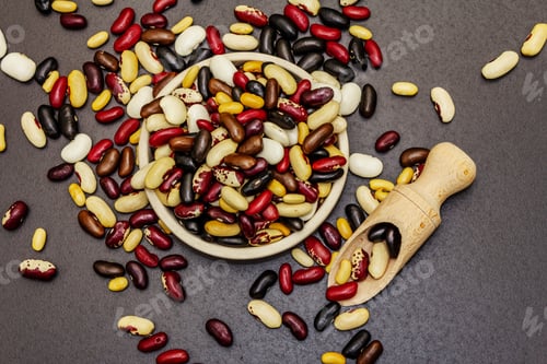 Preview: Assorted Different Types Of Beans In Ceramic Bowl. Mix Of Various Dry Legumes Scattered On Black