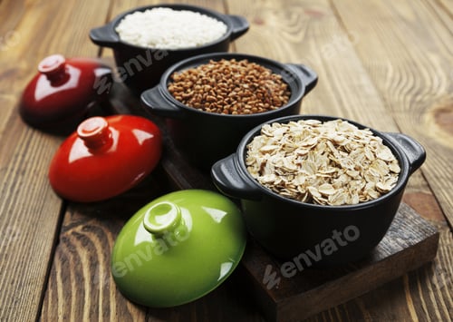 Preview: Buckwheat, Oats And Rice In A Ceramic Pot On The Table