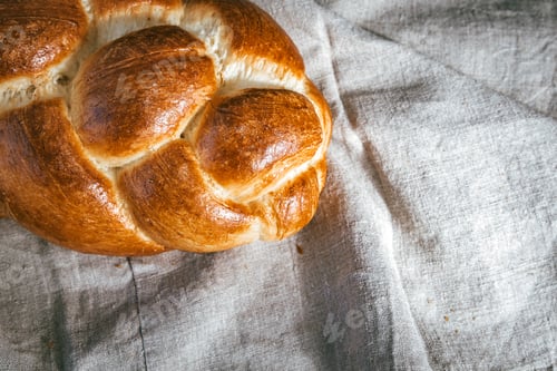 Preview: Homemade Jewish Traditional Challah Bread On Linen Tablecloth. Top View Of Fresh Baked Challah