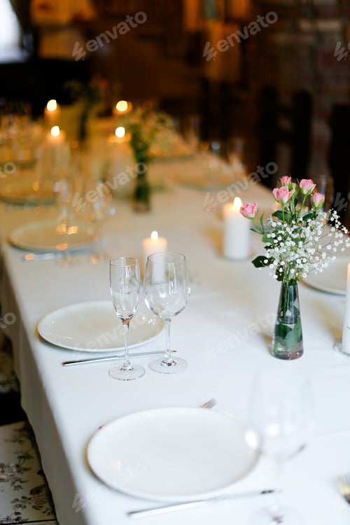 Preview: Bouguet Of Flowers, Plates With Forks And White Candles On Table. Oncept Of Romantic Dinner And