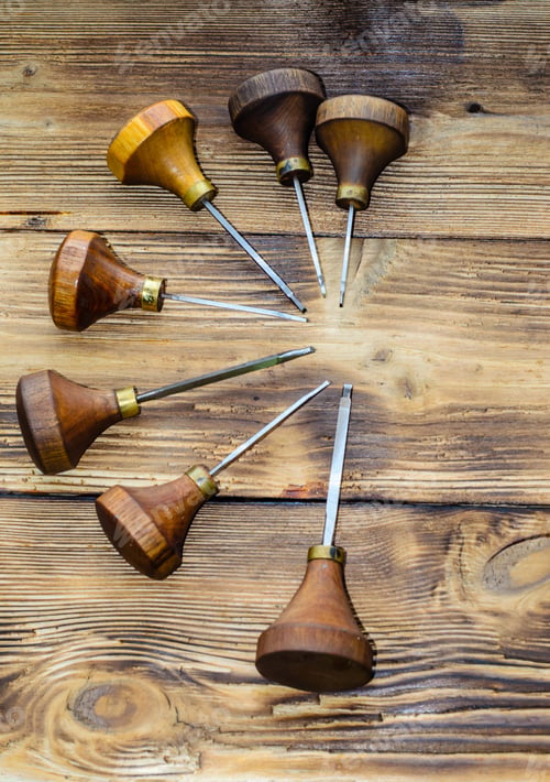 Preview: Different Gravers For Jewelry On A Wooden Background