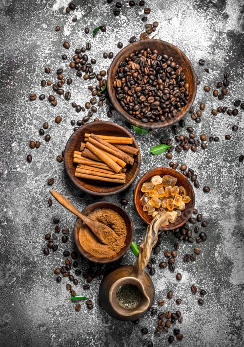 Preview: Fresh Coffee In A Clay Turkey With Crystals Of Sugar And Cinnamon. On A Rustic Background.