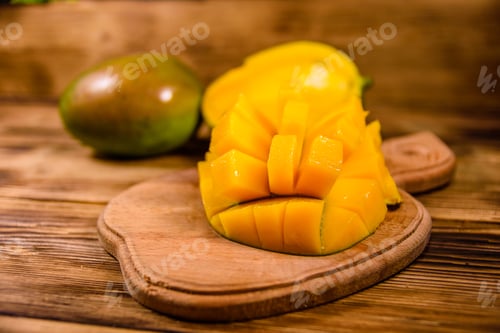 Preview: Cutting Board With Chopped Mango Fruit On Rustic Wooden Table