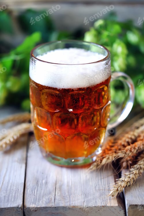 Preview: A Glass Of Wheat Beer On A Wooden Surface. Wheat And Hops. Beer Concept.