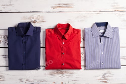 Preview: Business Stylish Men'S Shirts With Different Colors And Prints On Wooden Background.