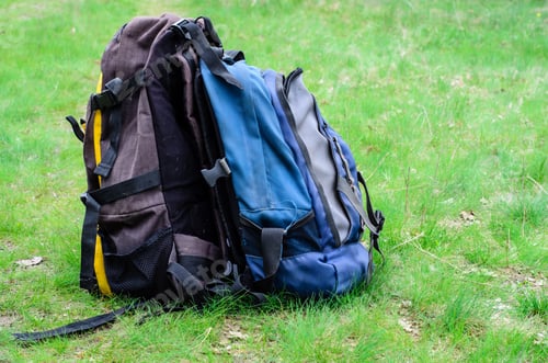 Preview: Two Touristic Backpacks On The Green Grass