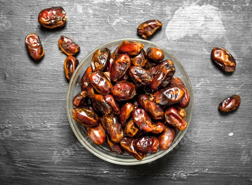 Preview: Dates In A Bowl. On A Black Chalkboard.