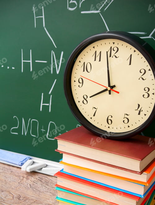 Preview: Watch And Books Against A School Board (Chemical Formulas).