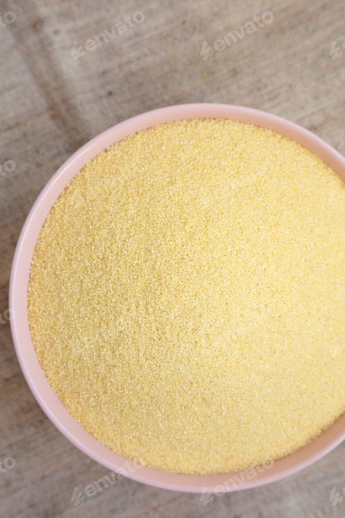 Preview: Dry Semolina Durum Flour In A Pink Bowl, Overhead View. Top View, From Above, Flat Lay.