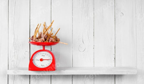 Preview: Garlic On Scales On A Wooden Shelf.