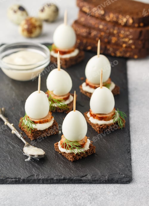 Preview: Black Rye Bread Appetizer With Sausage, Quail Eggs, Dill And Horseradish Sauce. Mini Sandwiches