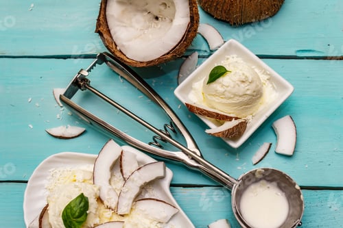 Preview: Lactose Free Coconut Ice Cream. Special Spoon, Halves Of Fruit, Flakes. Vegan Dessert Concept