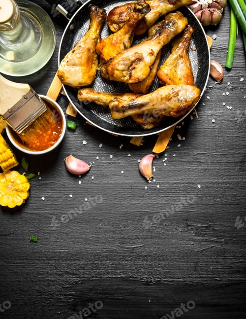 Preview: Fried Chicken Legs With Pieces Of Corn And Tomato Sauce.
